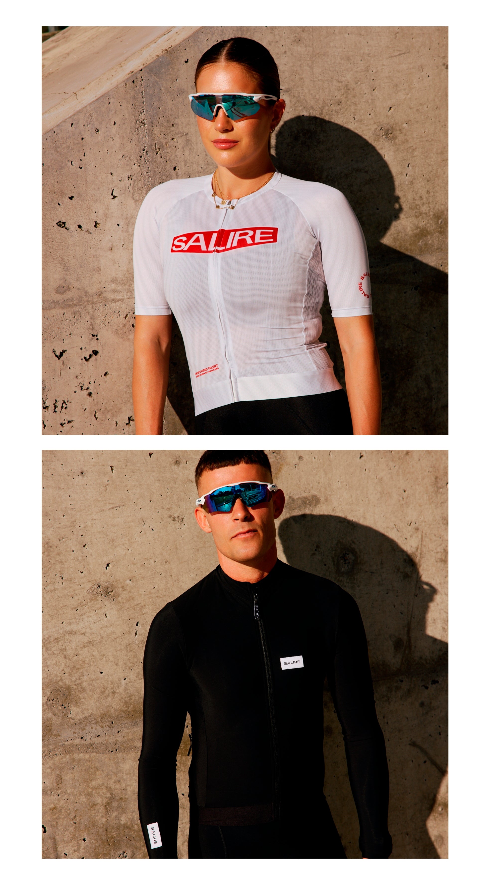 Two people wearing Salice cycling jerseys stand against a concrete wall.