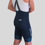 Person wearing navy blue cycling bib shorts with 'Salire' branding on a light gray background